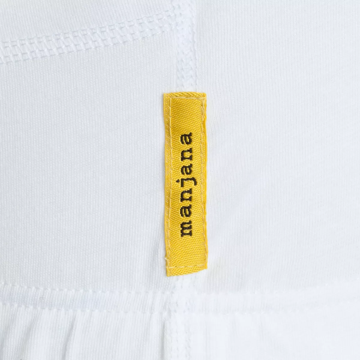 Nahaufnahme eines gelben sweatstop Labels auf weißem Stoff als Produktdetail